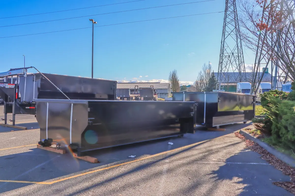 Roll-off dumpster ready for waste disposal at job site for Concrete Dumpster Rental in Semmes